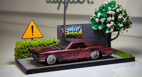 Miniatura vermelha em diorama